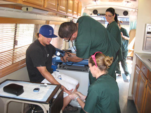 Man receiving care inside the Regional Center for Border Health mobile clinic