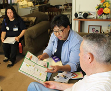 Woman and a man reviewing summer Youth Training Program brocure